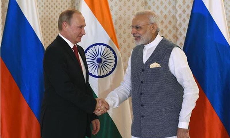 Russian President Vladimir Putin shakes hands with Indian PM Narendra Modi ahead of Indo-Russia Annual Summit in 2016. — AFP/File