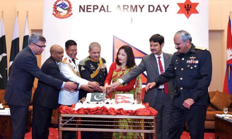 Ambassador Sewa Lamsal Adhikari, Col Hem Raj KC, Lt Gen Azhar Saleh Abbasi and other guests cut the cake on the occasion of Nepal Army Day in Islamabad.