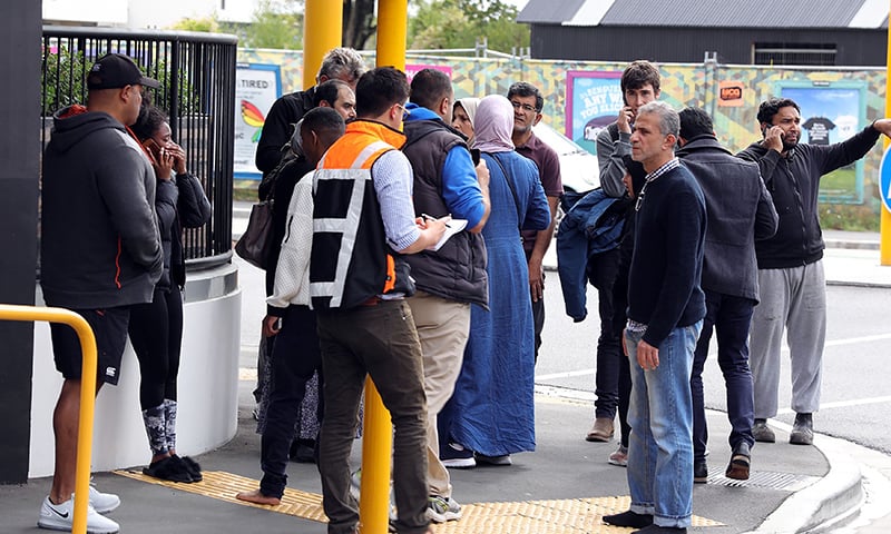 Residents gather close to a targeted mosque after a firing incident in Christchurch. — AFP/RADIO NEW ZEALAND