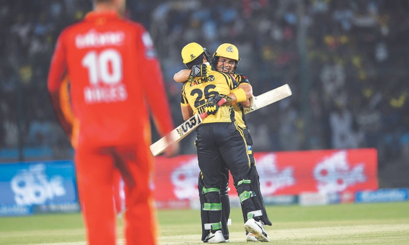 KARACHI: Kamran Akmal of Peshawar Zalmi celebrates after completing a half-century during the match against Islamabad United. KARACHI: Kamran Akmal of Peshawar Zalmi celebrates after completing a half-century during the match against Islamabad United.
