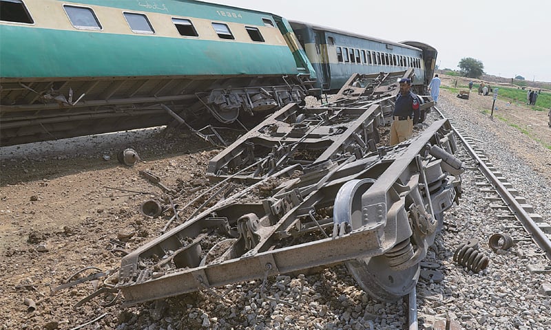 NASIRABAD: A policeman examines damaged carriages of Jaffar Express after the bomb blast.&mdash;AP