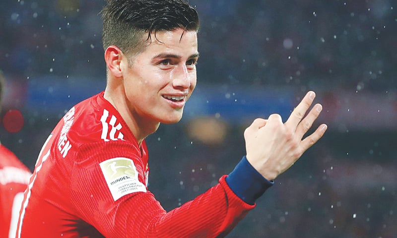 MUNICH: Bayern Munich&rsquo;s James Rodriguez celebrates after completing his hat-trick during the Bundesliga match against Mainz 05 at the Allianz Arena.&mdash;Reuters