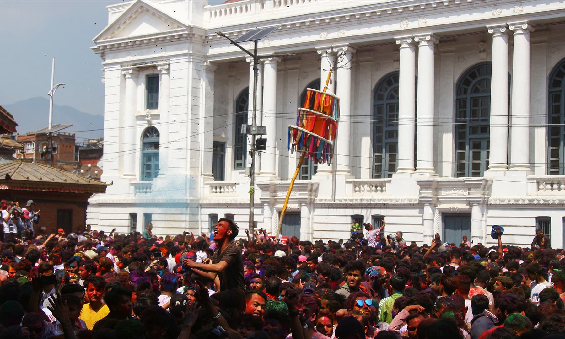 Nepali revellers celebrate with coloured powder during Holi festival in Kathmandu, Nepal, on March 20, 2019. &mdash; AFP