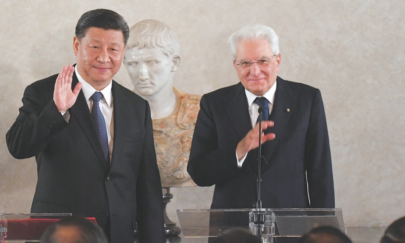 Rome: Chinese President Xi Jinping and Italian President Sergio Mattarella wave after addressing a forum of businessmen on Friday.—Reuters