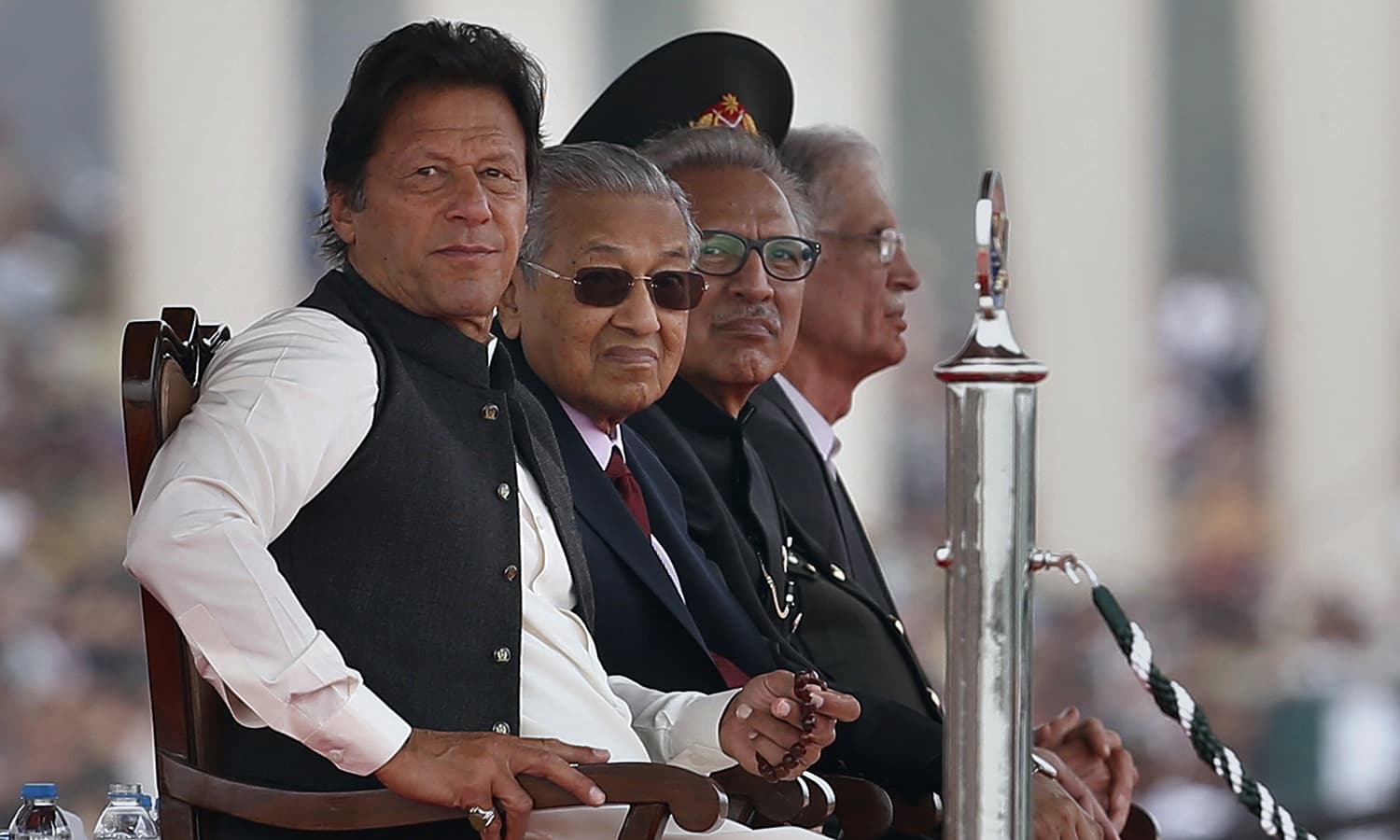 From left: Prime Minister Imran Khan, Malaysian Prime Minister Mahatir Mohamad, and President Arif Alvi attend the Pakistan Day military parade in Islamabad on March 23, 2019. ─ AP