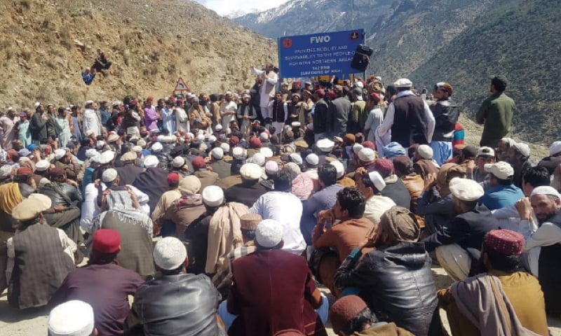 Protesters stage a sit-in on Karakoram Highway in Lower Kohistan on Sunday. — Dawn Protesters stage a sit-in on Karakoram Highway in Lower Kohistan on Sunday. — Dawn