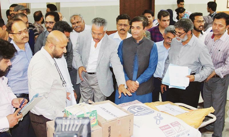 Mayor Wasim Akhtar with others  inspects medical instruments during his visit to the Abbasi Shaheed Hospital on Wednesday.—Online