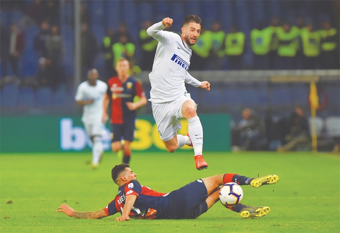 GENOA: Inter Milan’s Roberto Gagliardini (top) in action during the Serie A match against Genoa at the Stadio Comunale Luigi Ferraris.—Reuters