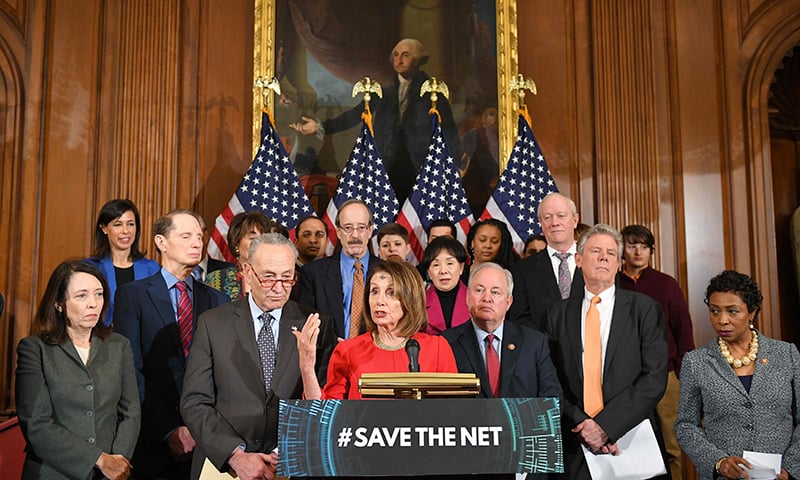 In this file photo taken on March 6, 2019 House Speaker Nancy Pelosi (C) speaks watched by  Senate Majority Leader Chuck Schumer (Center L), during an event to announce net neutrality protections legislation in the Rayburn Room of the US Capitol in Washington, DC. &mdash; AFP