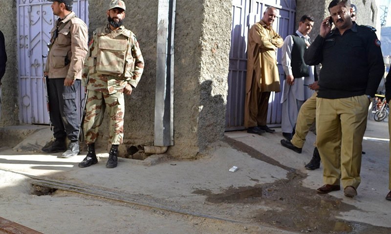 Police and security personnel are seen in this file photo. — AFP/File Police and security personnel are seen in this file photo. — AFP/File