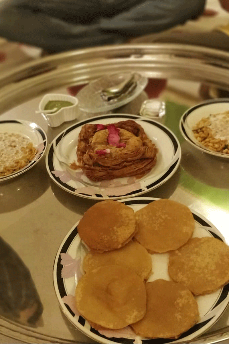 Top right: Kachori Papar, Top left: Boondi Raita. Centre: Malai Khaja.