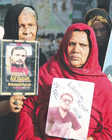 RELATIVES of missing persons hold a demonstration outside the press club on Friday. The protesters also condemned the Quetta Hazarganji attack earlier in the day.—Online