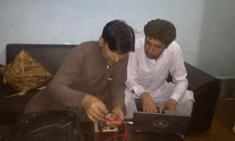 The two students work on the device. — Photo provided by author