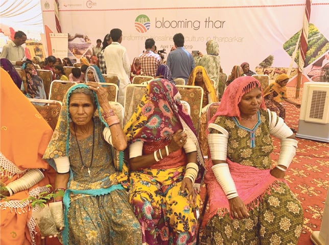 SOME of the Thari women among the audience at the programme.—Dawn
