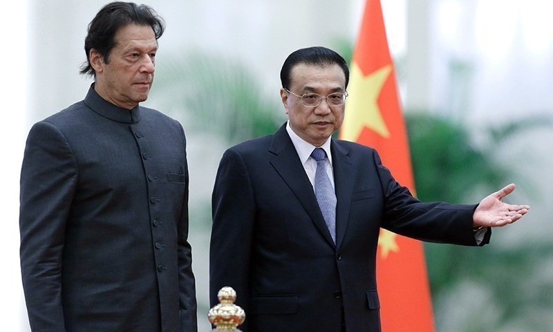 Prime Minister Imran Khan and China's Premier Li Keqiang at a welcome ceremony at the Great Hall of the People in Beijing. — AFP/File