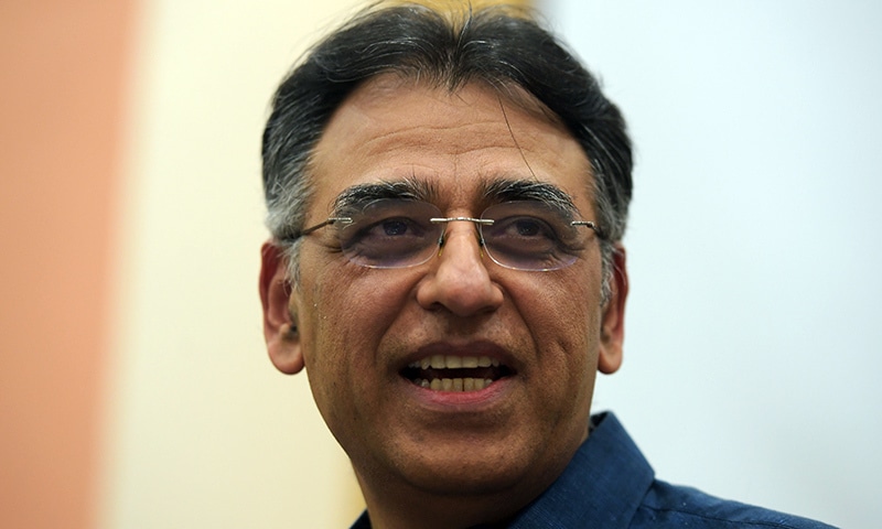 Finance Minister Asad Umar speaks to the media during a press conference, after stepping down from his ministry, in Islamabad on Thursday. — AFP