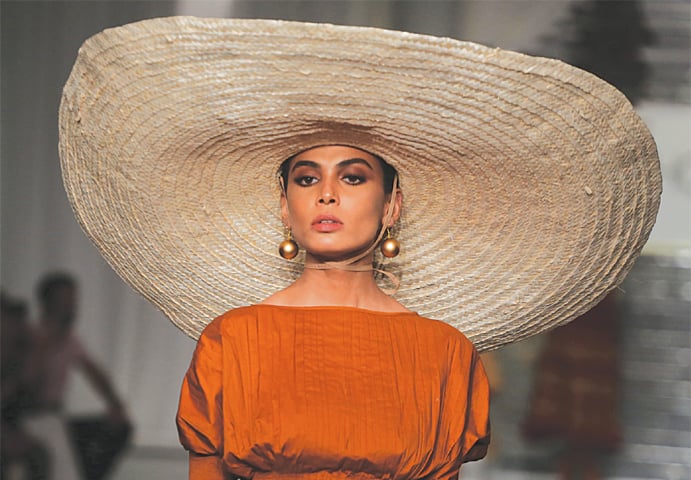 A MODEL wears a creation by opening designer Zaheer Abbas on the first day of the three-day Hum Showcase at a local hotel on Thursday.—Shakil Adil/White Star