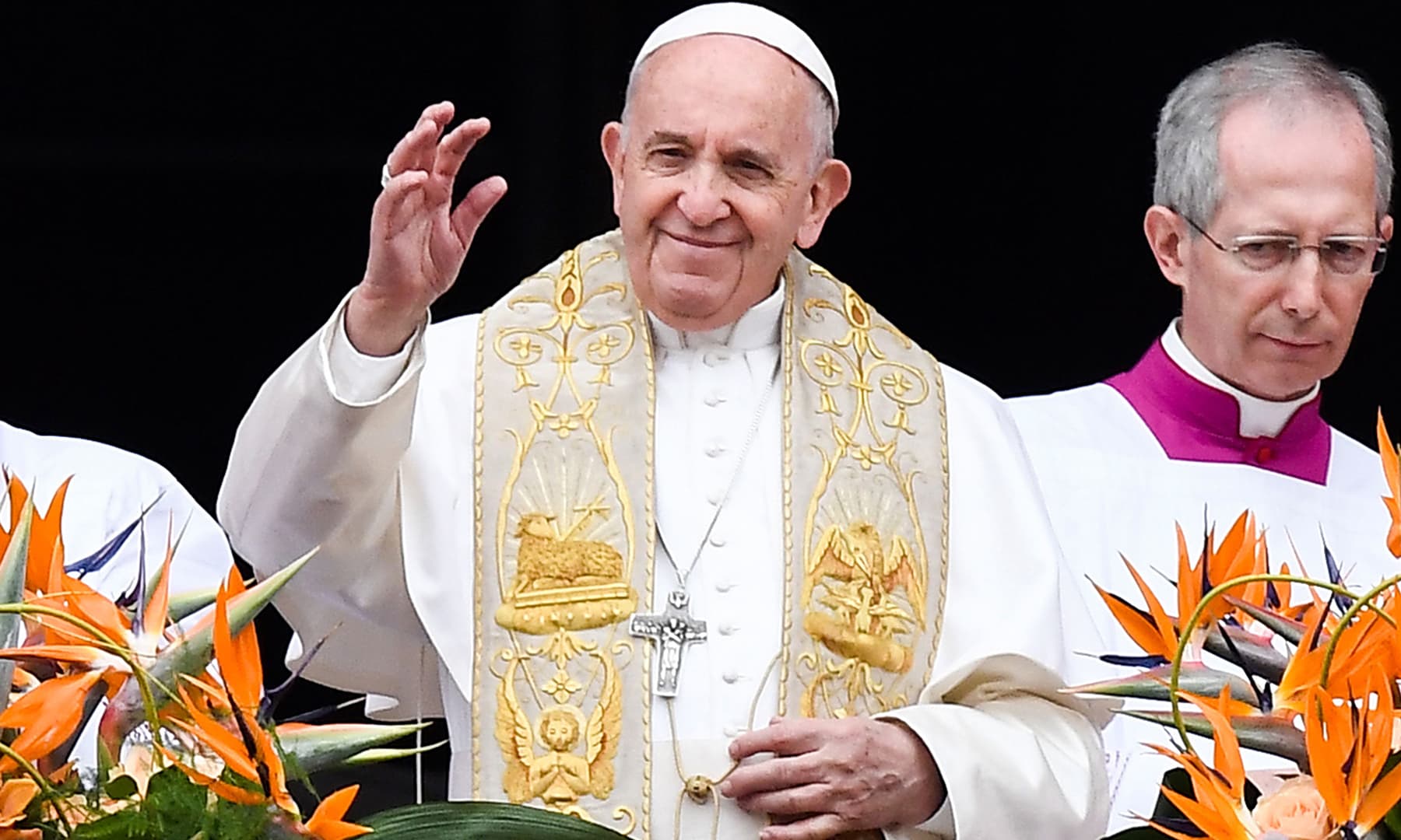 Pope Francis smiling whilst delivering the "Urbi et Orbi" blessing from the balcony of St Peter's basilica. — AFP