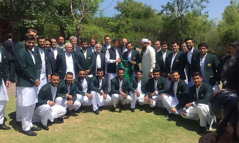 Prime Minister Imran Khan takes a photograph with the Pakistan cricket team at Bani Gala on April 19. ─ Photo courtesy PTI Twitter/File