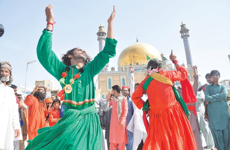 Devotees whirl in trance as they perform dhamal to pay respects to their saint.&mdash;Dawn