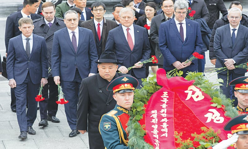 Vladivostok (Russia): North Korean leader Kim Jong Un (centre) attends a wreath-laying ceremony and pays his respects at a memorial for the war dead on Friday.—AP