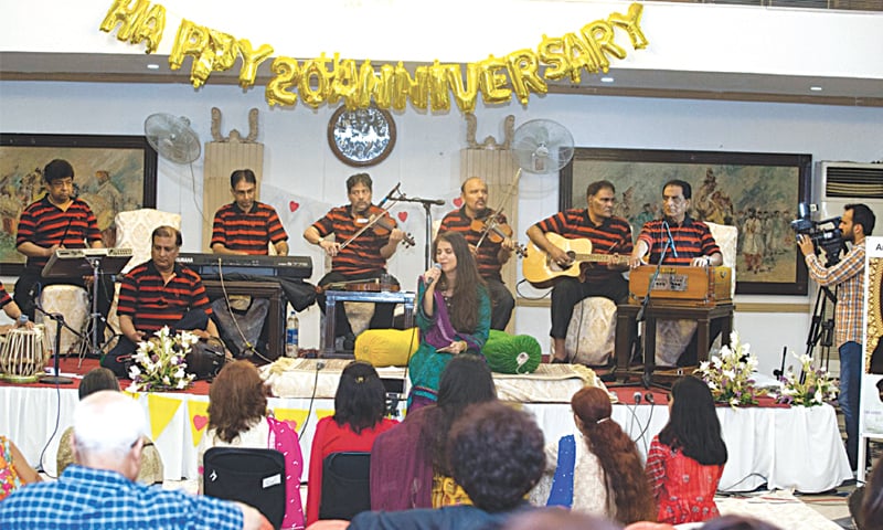 Zara Madani sings at the event.&mdash;Photo by writer