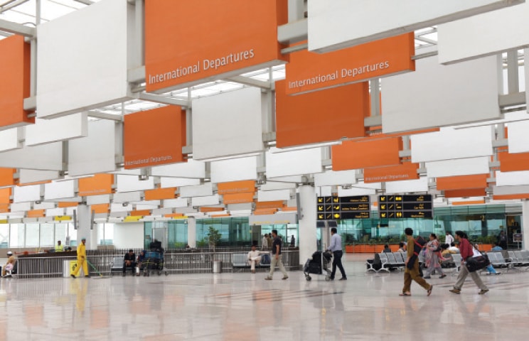 Passengers enter the airport’s international departure lounge. — Photo by Tanveer Shahzad