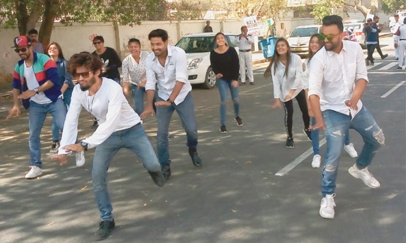 Young volunteers at the walk perform a flash mob dance on a national song.—Photo by writer