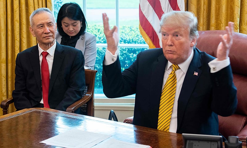 In this file photo taken on April 4, 2019, US President Donald Trump (R) speaks during a trade meeting with China's Vice Premier Liu He (L) in the Oval Office at the White House in Washington, DC. — AFP