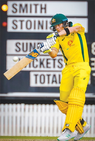 BRISBANE: Australian batsman Steve Smith plays a shot during the World Cup warm-up against New Zealand on Friday.—AFP