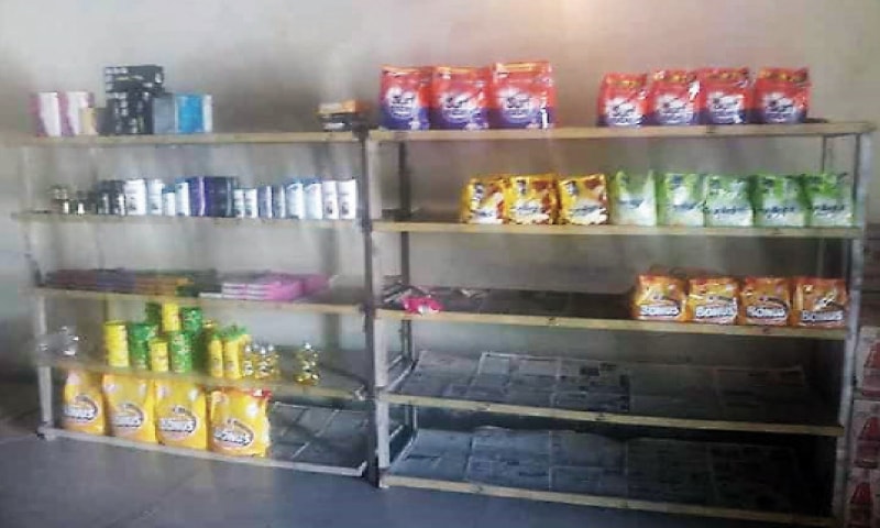 Empty shelves at a utility store in Bajaur tribal district. &mdash; Dawn