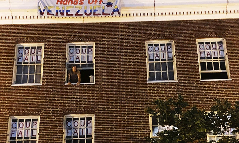 An activist who supports Nicolas Maduro stands by the window of the Venezuelan Embassy in Washington on Monday, May 13, 2019. — AP An activist who supports Nicolas Maduro stands by the window of the Venezuelan Embassy in Washington on Monday, May 13, 2019. — AP