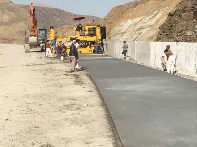 Concrete being laid at a section of Havelian Motorway in Haripur. — Dawn