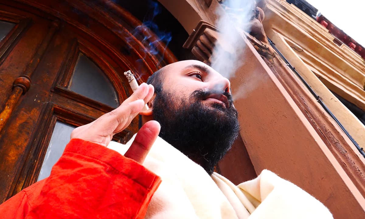 Fahad smoking outside his apartment building in Brooklyn | Courtesy Fahad Naveed