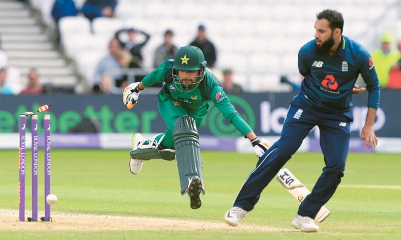 LEEDS: England’s Adil Rashid manages to run out Babar Azam during the fifth One-Day International against Pakistan on Sunday.—AFP