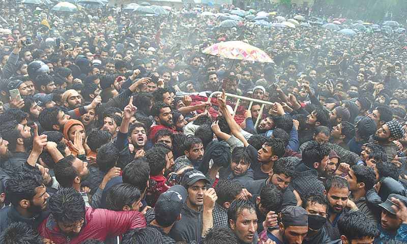 THOUSANDS of villagers attend the funeral of Zakir Musa in Tral, south of Srinagar, on Friday.—AFP