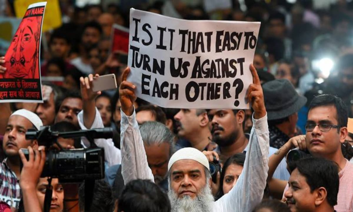 Citizens hold placards during a silent protest " Not in My Name " against the targeted lynching, at Jantar Mantar in New Delhi | PTI/Shahbaz Khan