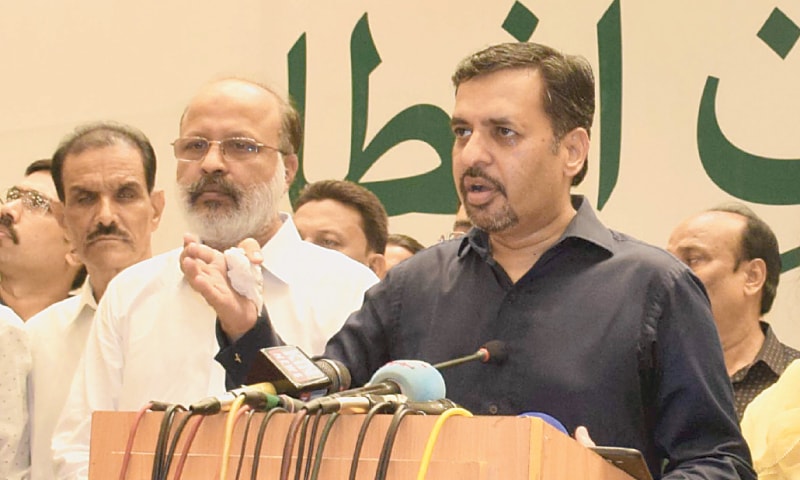 PSP leader Syed Mustafa Kamal speaks at the gathering in Hyderabad on Sunday.&mdash;Dawn