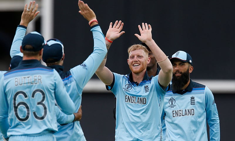 England's Ben Stokes (C) celebrates with teammates after taking the last wicket of South Africa's Imran Tahir and England win by 104 runs in the 2019 Cricket World Cup group stage match between England and South Africa. — AFP