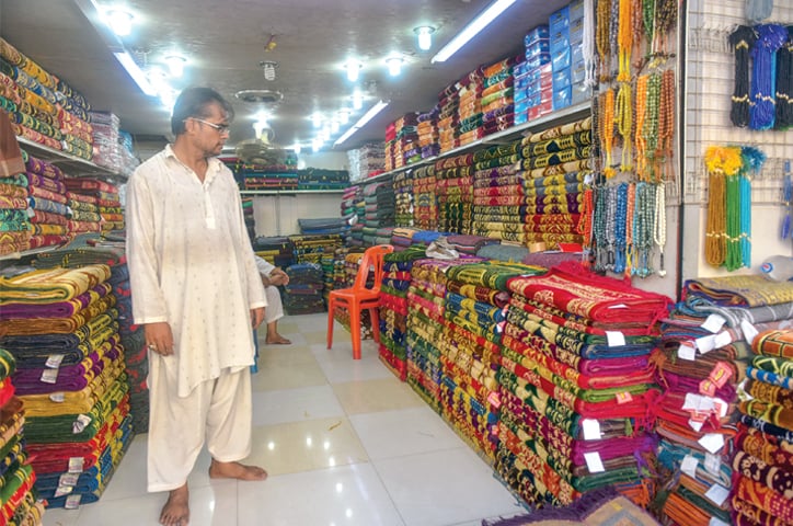 A huge variety of prayer mats and a difficult choice to make. Photos by Fahim Siddiqi / White Star