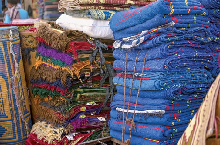 Prayer mats made from woven khais for uneven ground or mass use.