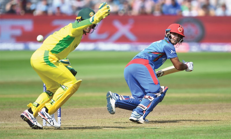 AFGHANISTAN’S Najibullah Zadran takes a run as Australian wicket-keeper Alex Carey looks on during their match at County Ground on Saturday.—AFP