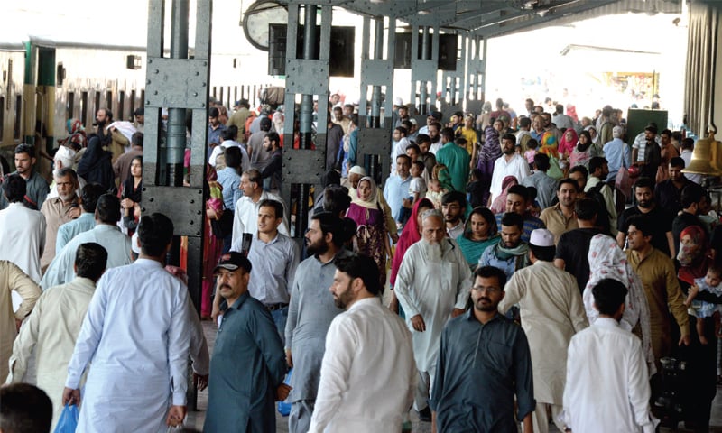 People wait on the platform for their train at the Rawalpindi Railway Station on Sunday. &mdash; Photo by Mohammad Asim