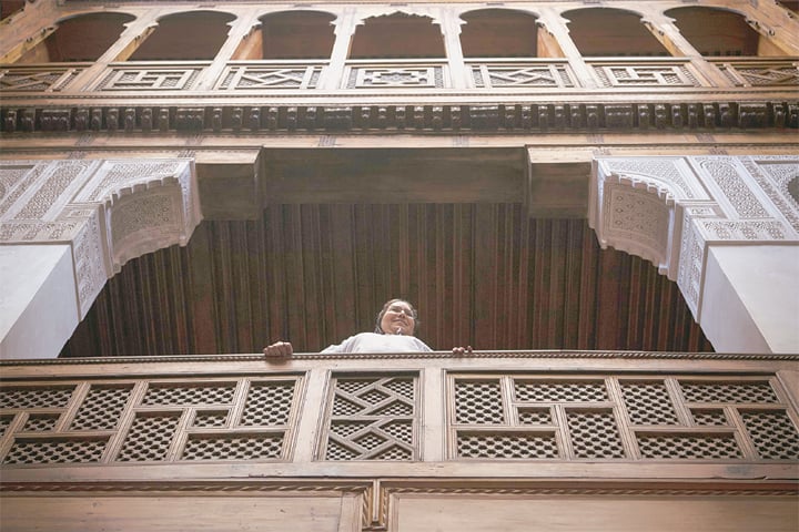 Fez: A woman stands in the balcony of an old building in the ninth century walled quarter of this ancient city.—AFP