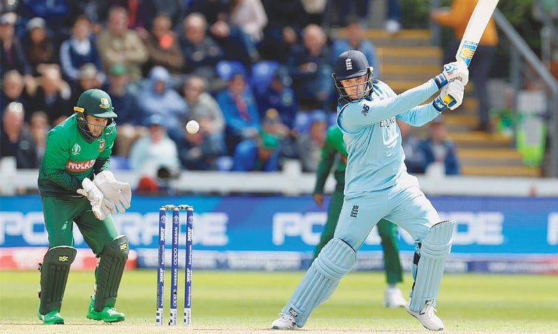 CARDIFF: England opener Jason Roy drives forcefully as Bangladesh wicket-keeper Mushfiqur Rahim looks on during their match at Sophia Gardens 
on Saturday.—Reuters