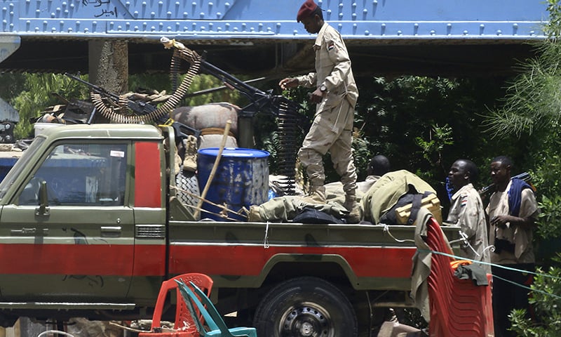 Members of Sudan's paramilitary Rapid Support Forces patrol Nile street in the capital Khartoum on June 10. ─ AFP