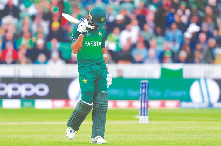 PAKISTAN’S Wahab Riaz walks off after being dismissed on Wednesday.—Reuters