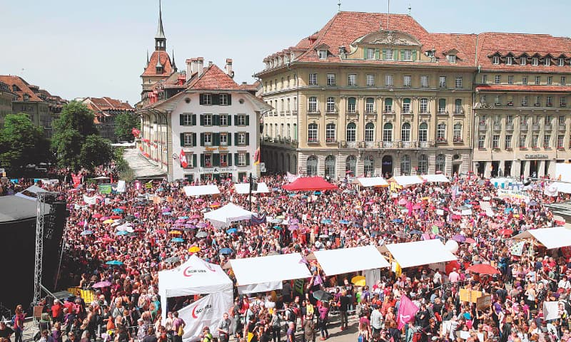BERN: Women gather for a rally in front of the federal palace on Friday.&mdash;AFP