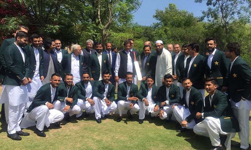 In this file photo, Prime Minister Imran Khan takes a photograph with the Pakistan cricket team at Bani Gala prior to the World Cup. ─ Photo courtesy PTI Twitter