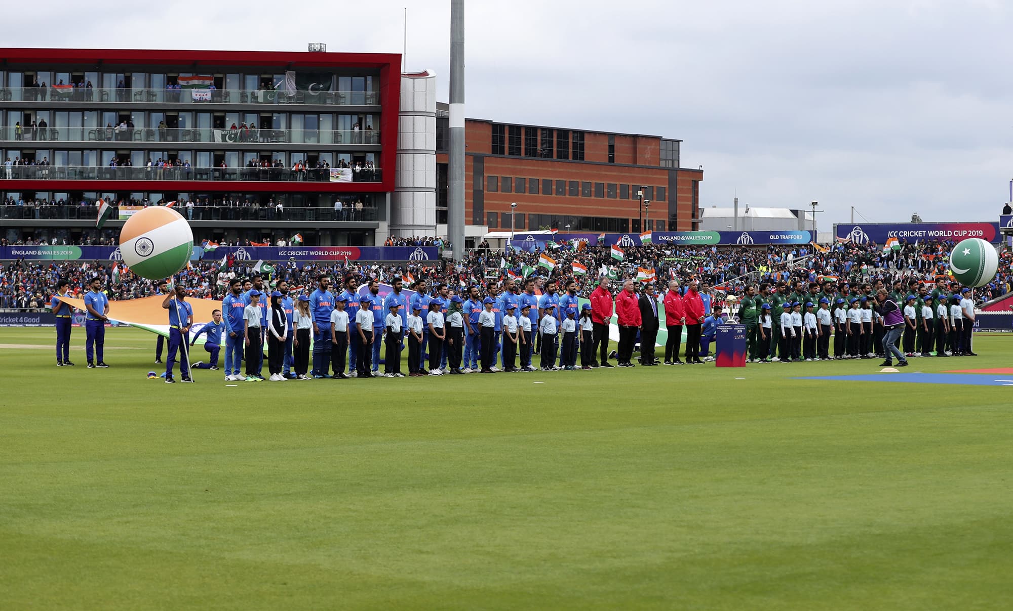 Indian and Pakistan players stand for their national anthems before the start of the match. ─ AP